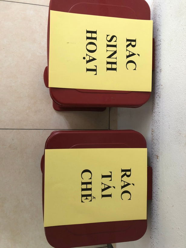 Two boxes with yellow paper on them

Description automatically generated