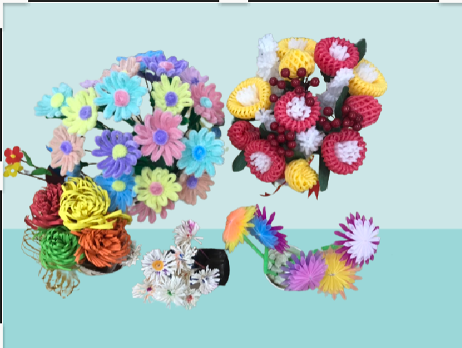 A group of flowers made from plastic

Description automatically generated